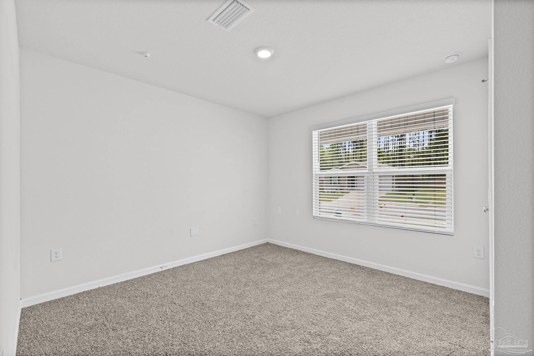 5771 Belmont Stakes Road Pensacola, FL 32526 - Photo 23 of 36 an empty room with a window
