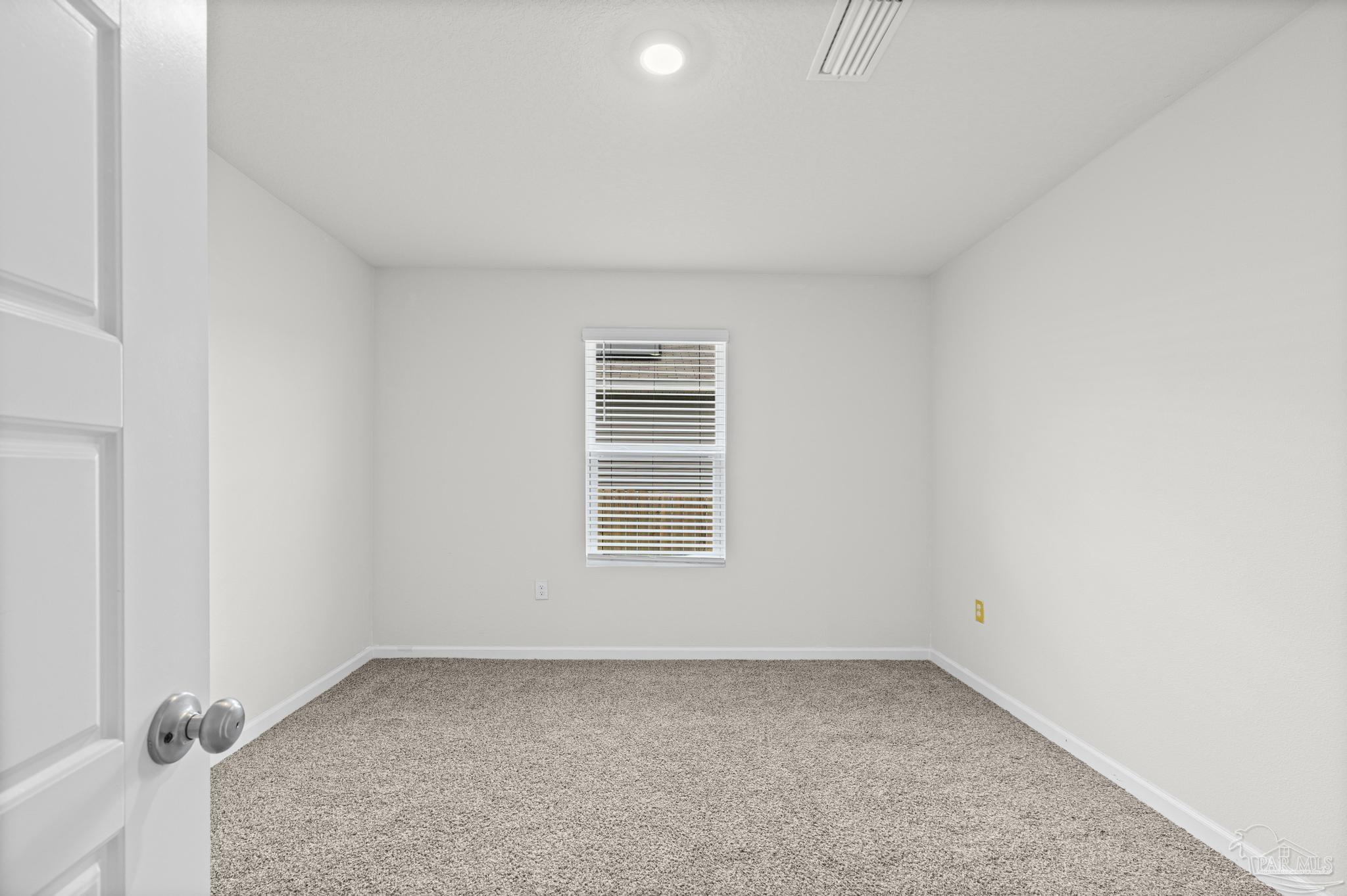 5771 Belmont Stakes Road Pensacola, FL 32526 - Photo 24 of 36 an empty room with a window