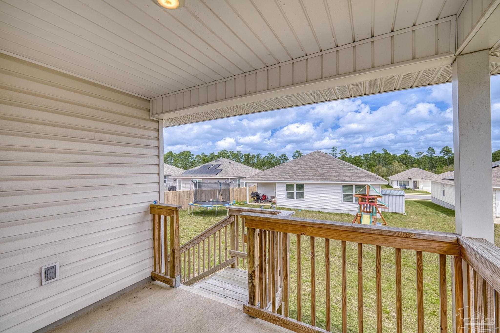 5771 Belmont Stakes Road Pensacola, FL 32526 - Photo 31 of 36 a view of a houses with a balcony