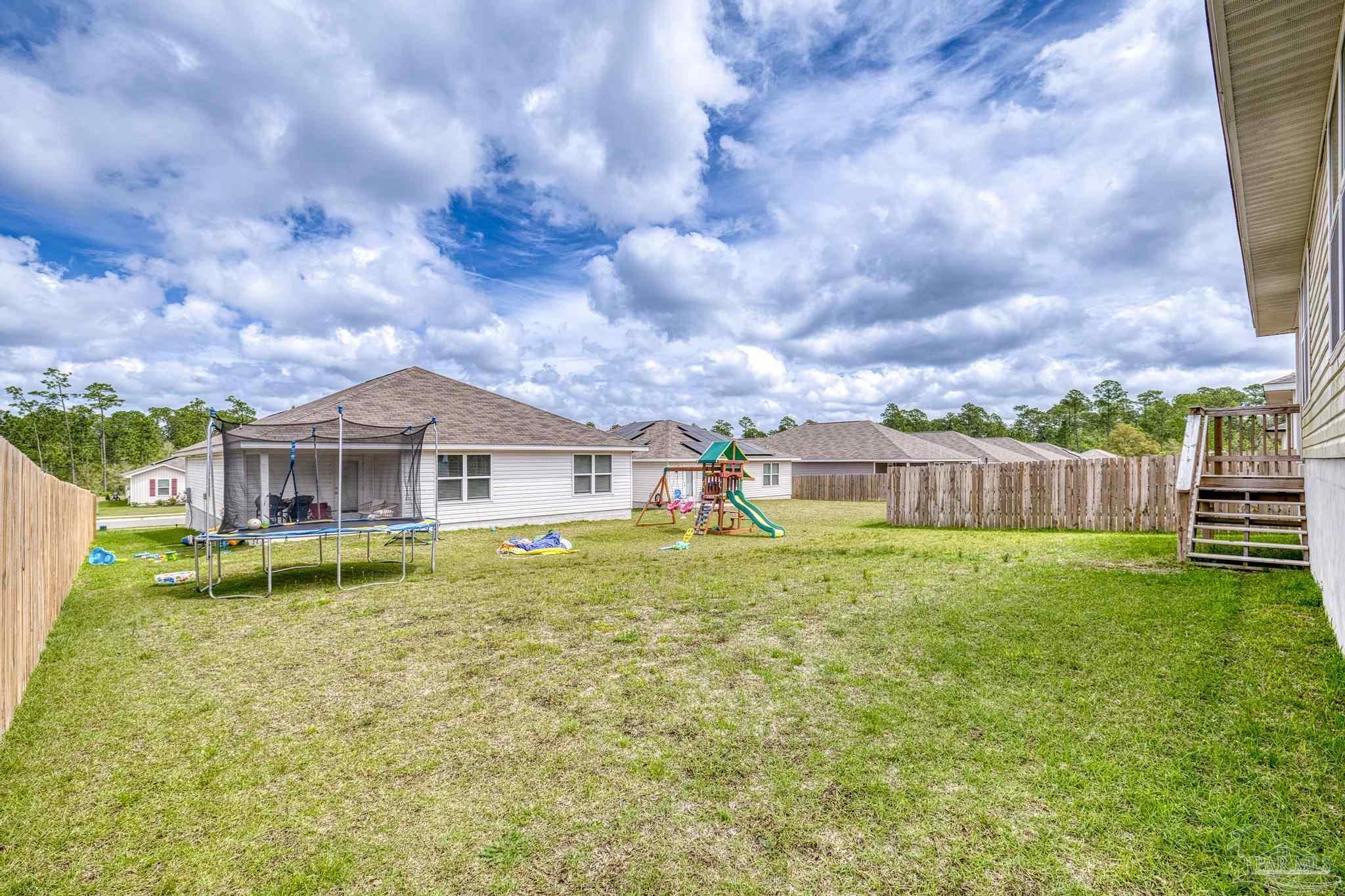 5771 Belmont Stakes Road Pensacola, FL 32526 - Photo 36 of 36 a view of a house with a big yard and a fountain