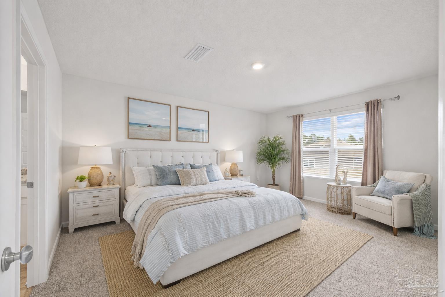 5771 Belmont Stakes Road Pensacola, FL 32526 - Photo 5 of 36 a bedroom with a bed and a couch with window
