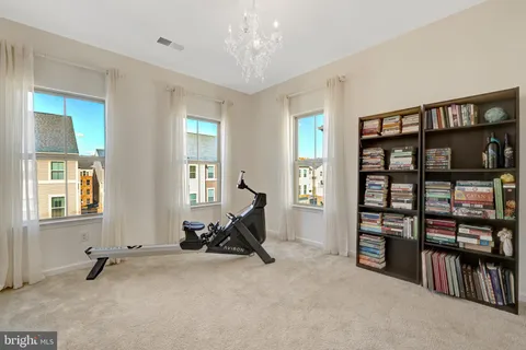 a view of a room with gym equipment and a window