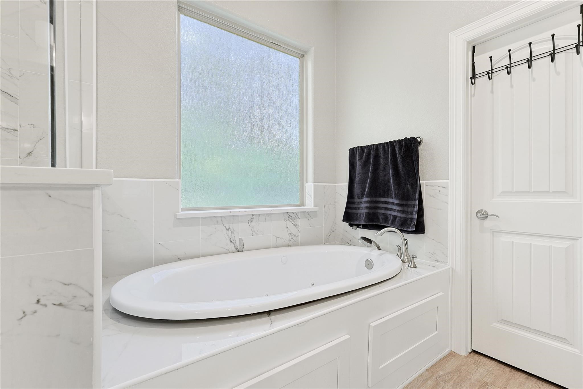 642 Parthenon Place New Caney, TX 77357 - Photo 14 of 30 a bathroom with a sink and a bathtub