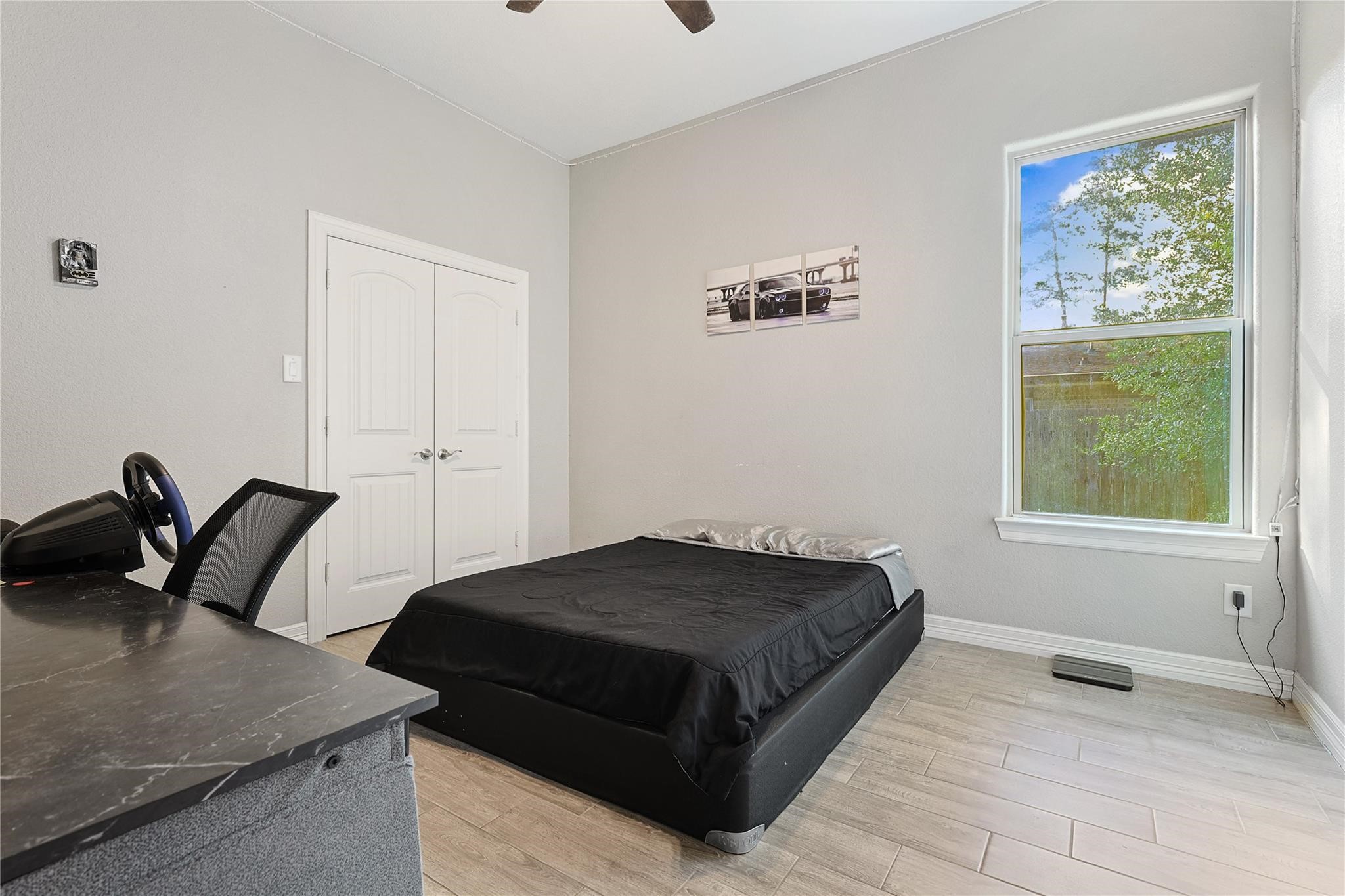 642 Parthenon Place New Caney, TX 77357 - Photo 17 of 30 a bedroom with a bed and a window