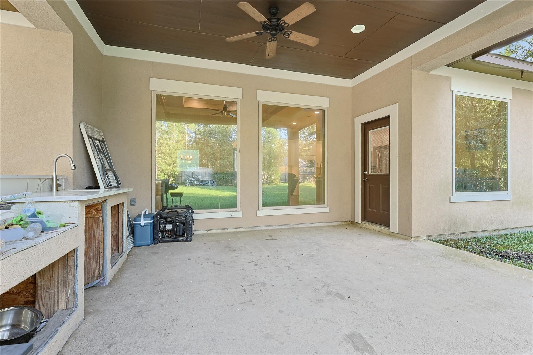 642 Parthenon Place New Caney, TX 77357 - Photo 24 of 30 a view of a kitchen with a sink and a fireplace