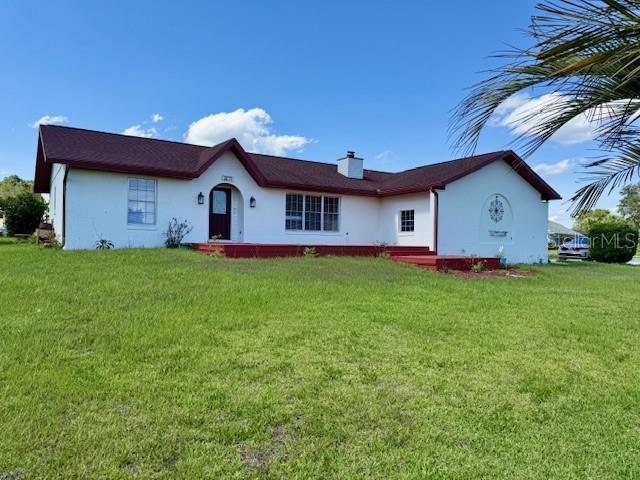 8770 Southwest 196th Terrace Road Dunnellon, FL 34432 - Photo 1 of 1 a front view of house with yard and green space