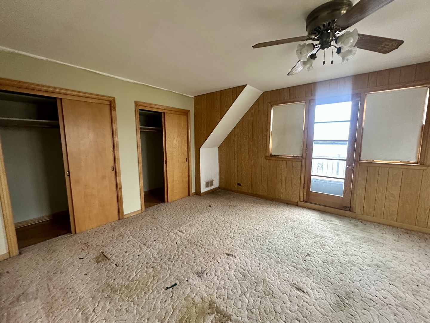 7000 West Henderson Street Chicago, IL 60634 - Photo 21 of 30 a view of a livingroom with a ceiling fan and window