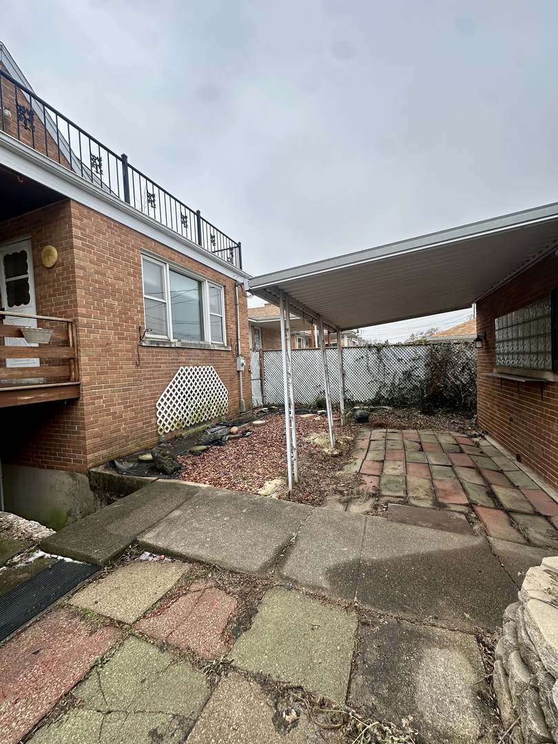 7000 West Henderson Street Chicago, IL 60634 - Photo 26 of 30 a view of a house with backyard