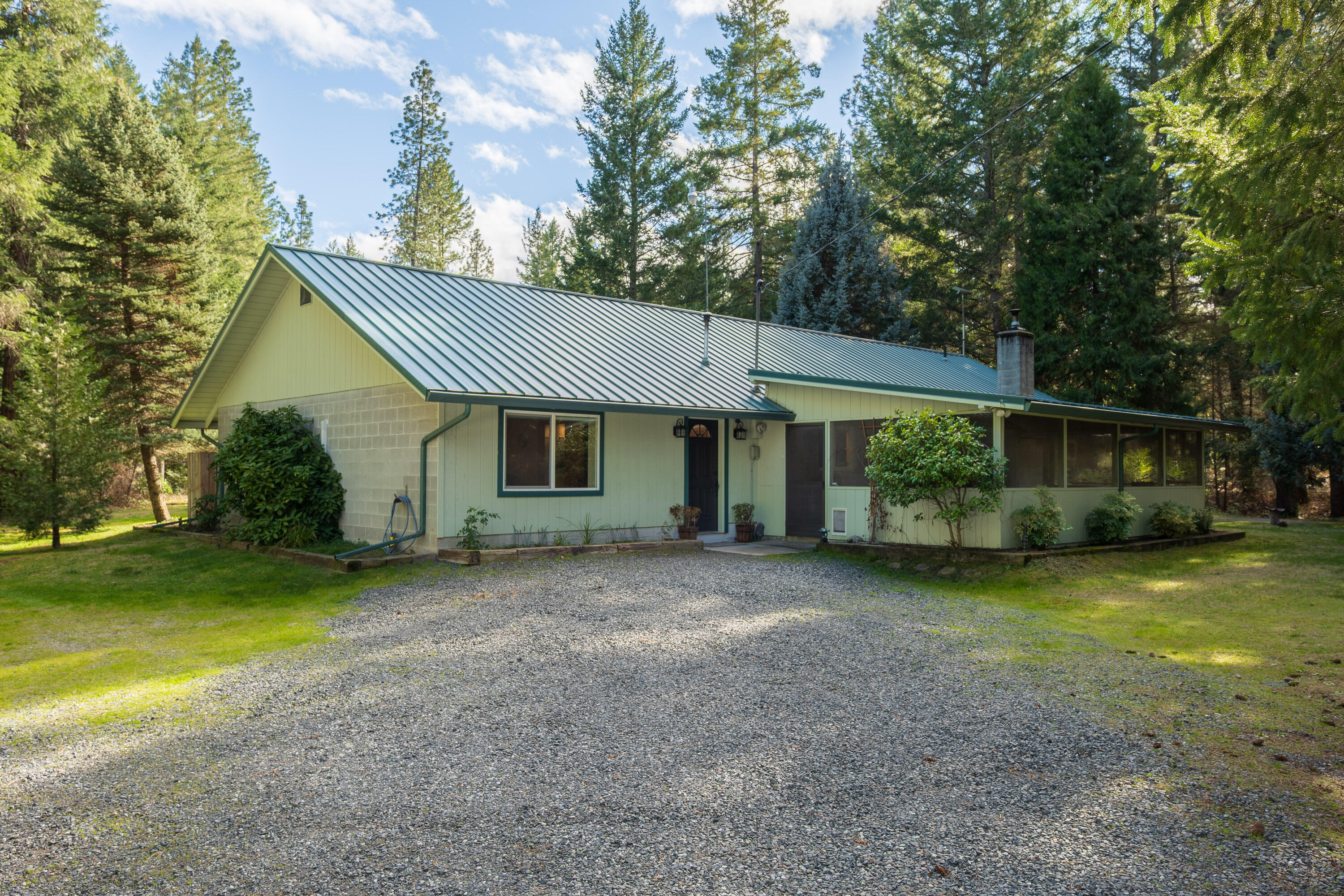244 Riessen Road Grants Pass, OR 97526 - Photo 2 of 52 a view of a house with a backyard