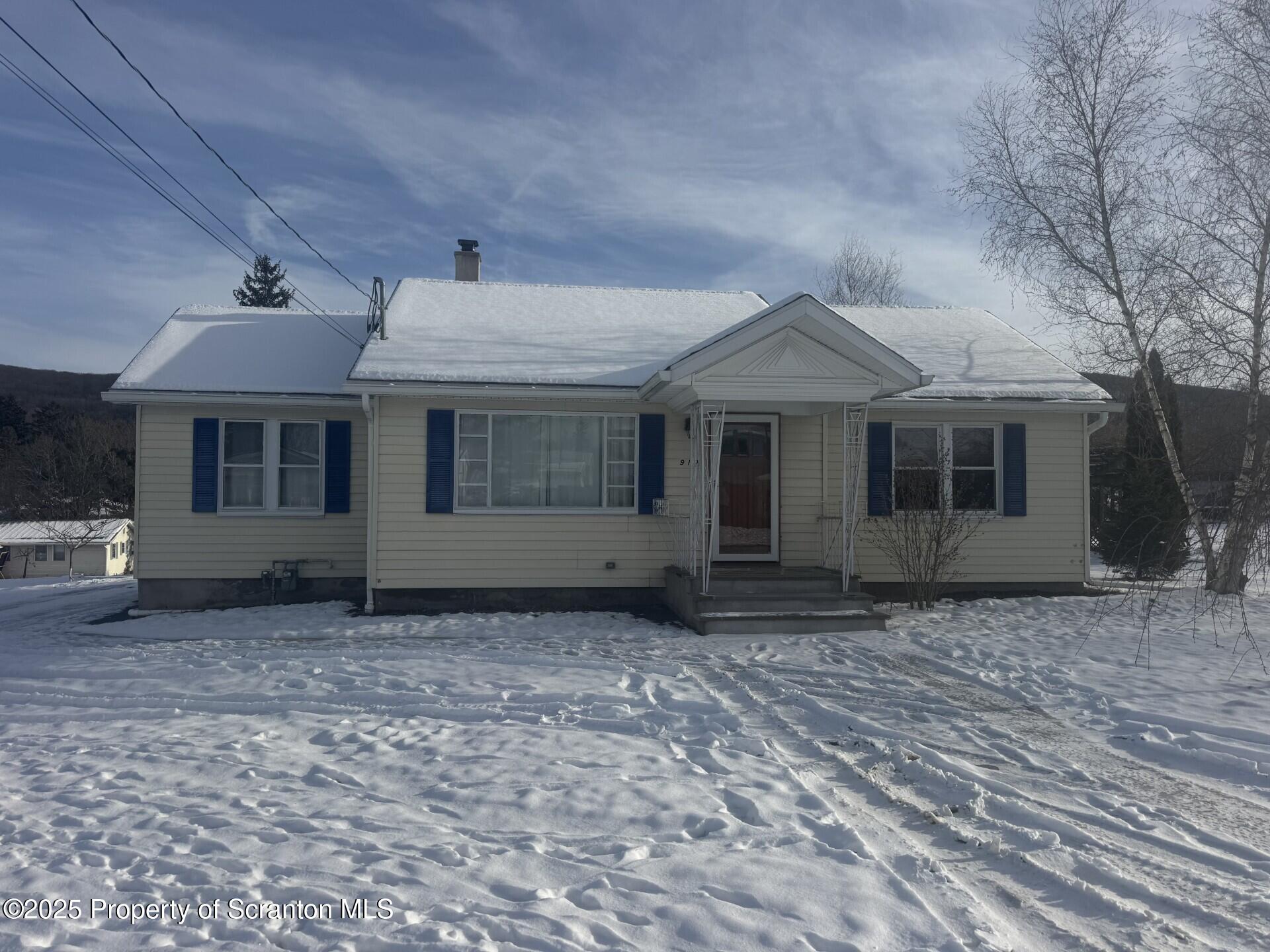 910 Bernard Avenue Clarks Summit, PA 18411 - Photo 1 of 17 a front view of a house with a garden