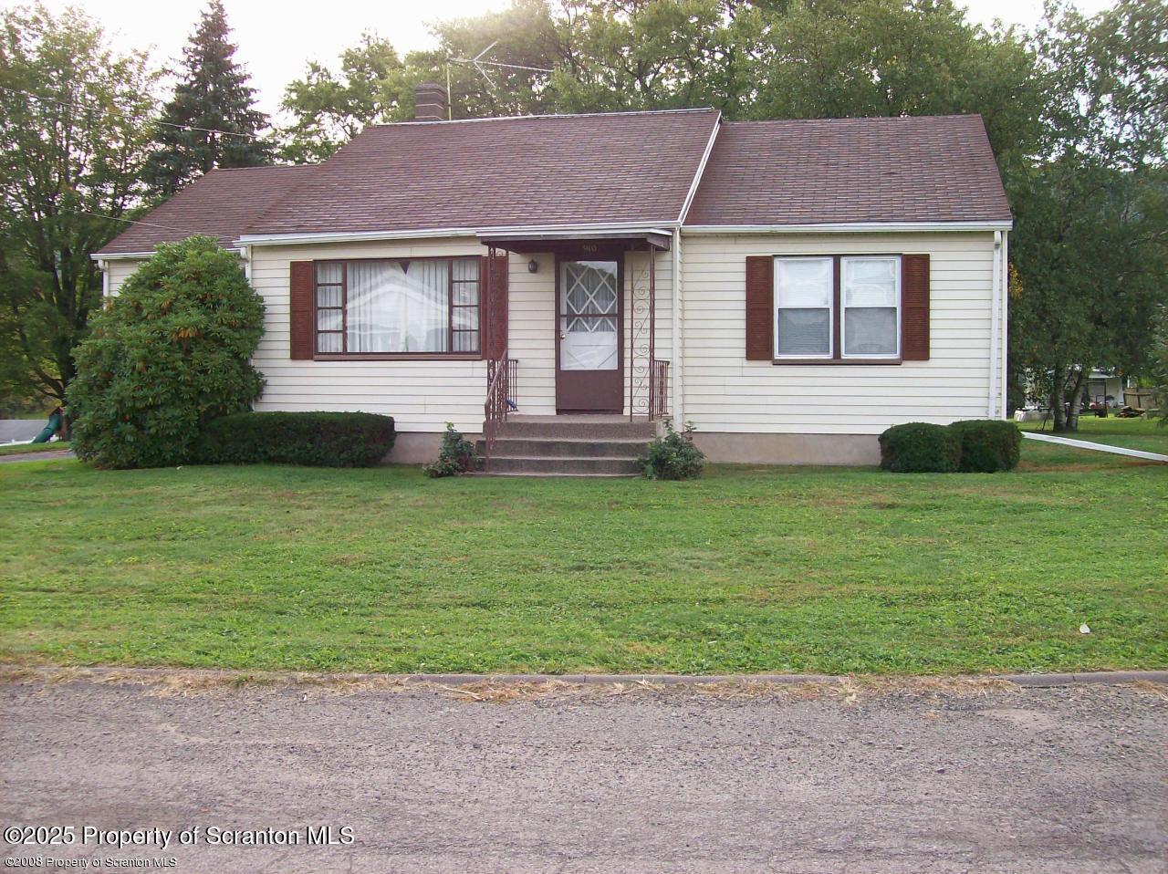 910 Bernard Avenue Clarks Summit, PA 18411 - Photo 17 of 17 a front view of a house with a yard and garage