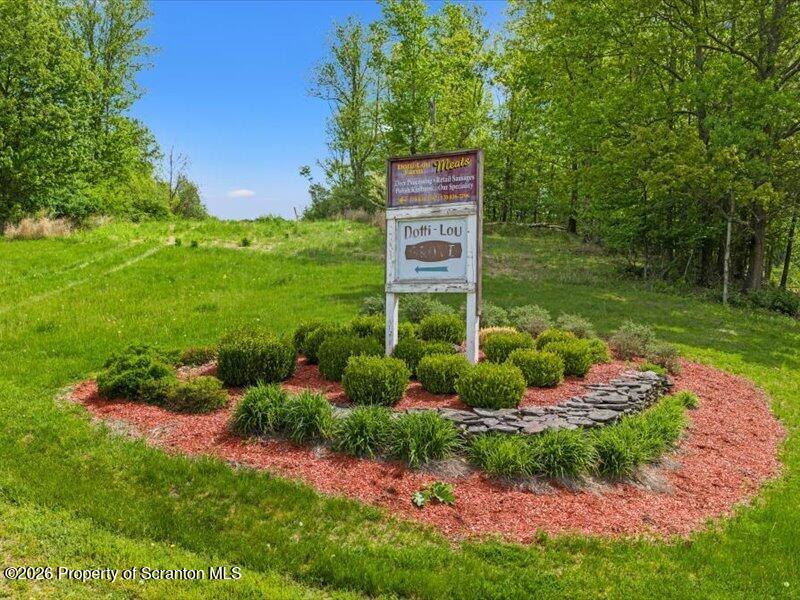 9-17 Vago Road Tunkhannock, PA 18657 - Photo 4 of 57 a view of a garden with a bench