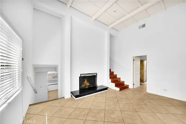 a bedroom with a bed and a chair