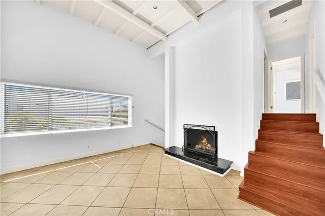 a view of an entryway with wooden floor and fire place