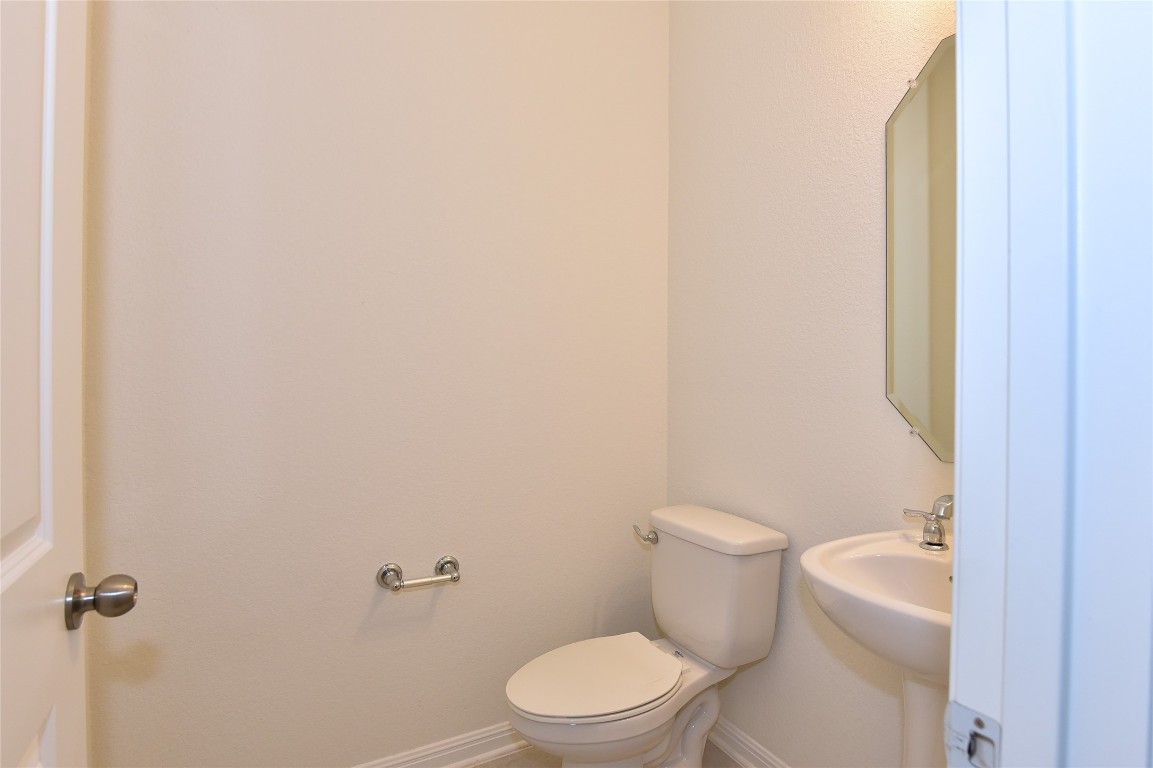 5008 Risana Bend Round Rock, TX 78665 - Photo 15 of 21 a white toilet sitting next to a white wall