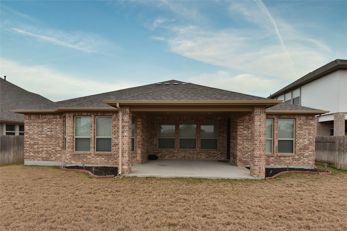 5008 Risana Bend Round Rock, TX 78665 - Photo 18 of 21 a front view of a house with a yard and garage