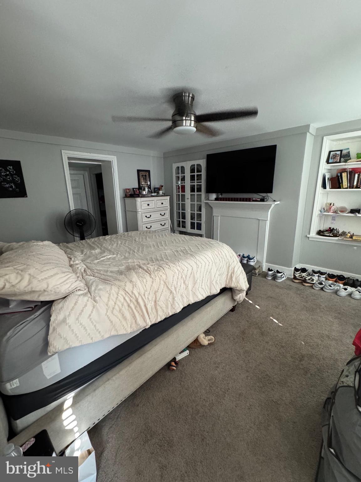 661 Ridge Pike Lafayette Hill, PA 19444 - Photo 8 of 17 a bedroom with a large bed and a flat tv screen on dresser