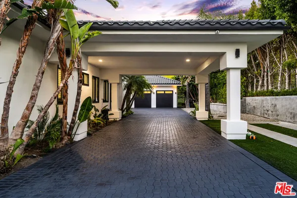 a view of a porch with a hanging chair