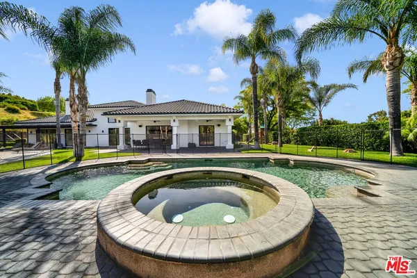 a view of a swimming pool with a garden