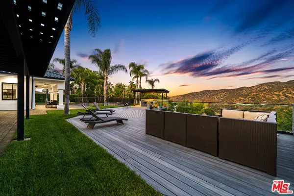 a view of a terrace with sitting area