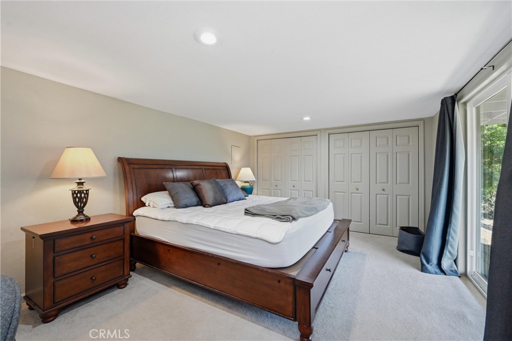 17432 Greenridge Road Hidden Valley Lake, CA 95467 - Photo 62 of 72 a bedroom with a bed and a window