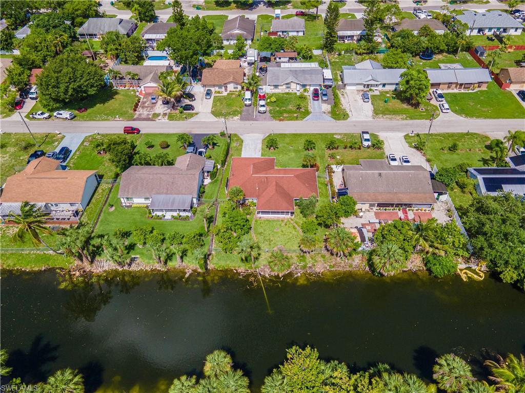 2100 55th Street Southwest Naples, FL 34116 - Photo 34 of 50 an aerial view of house with yard swimming pool and outdoor seating