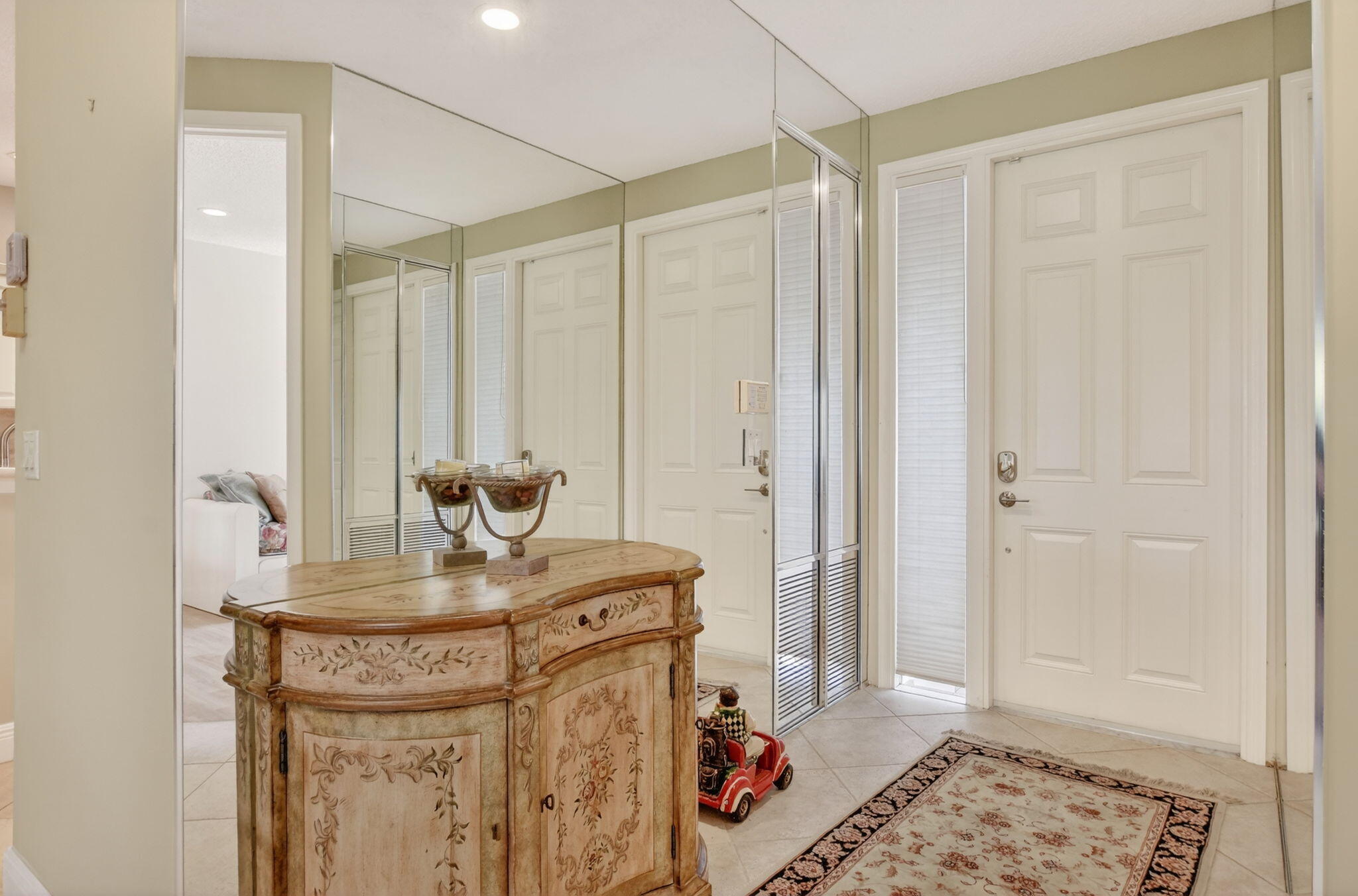 20220 Boca W Drive, Unit 702 Boca Raton, FL 33434 - Photo 1 of 51 a bathroom with a sink a mirror and vanity