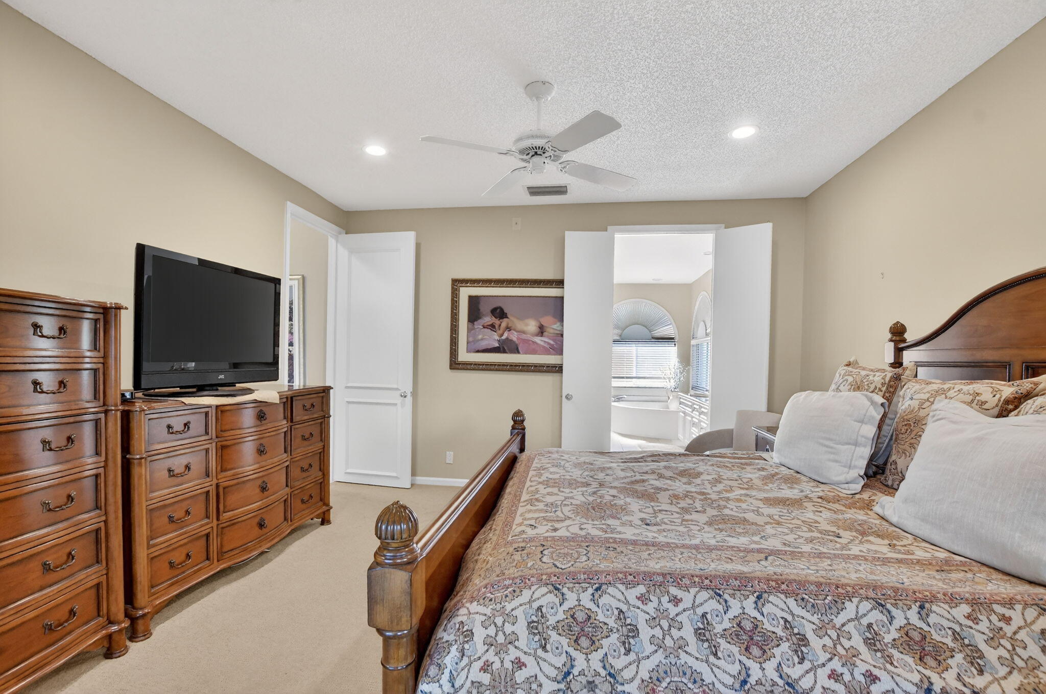 20220 Boca W Drive, Unit 702 Boca Raton, FL 33434 - Photo 15 of 51 a bedroom with a bed and a flat screen tv