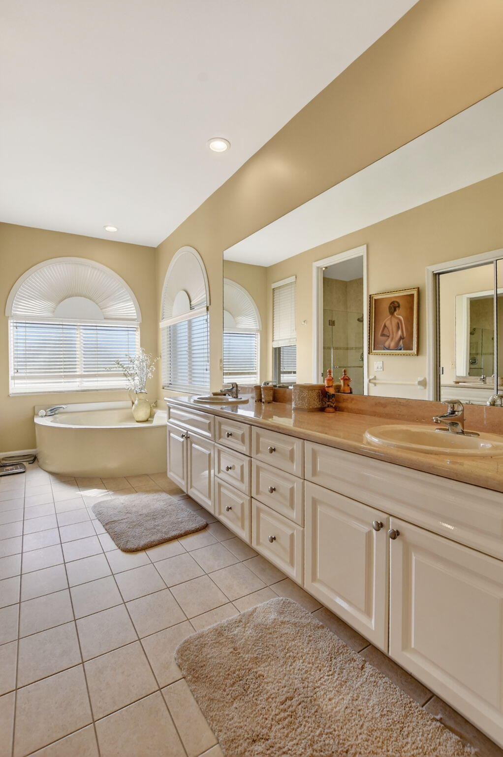 20220 Boca W Drive, Unit 702 Boca Raton, FL 33434 - Photo 17 of 51 a spacious bathroom with a granite countertop sink and a mirror