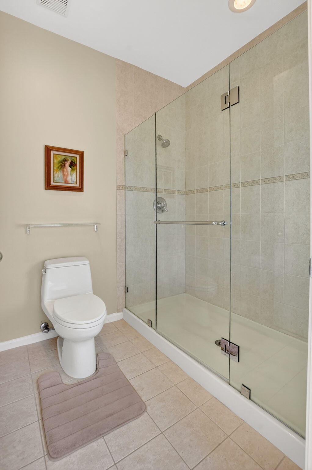20220 Boca W Drive, Unit 702 Boca Raton, FL 33434 - Photo 18 of 51 a bathroom with a toilet and a shower
