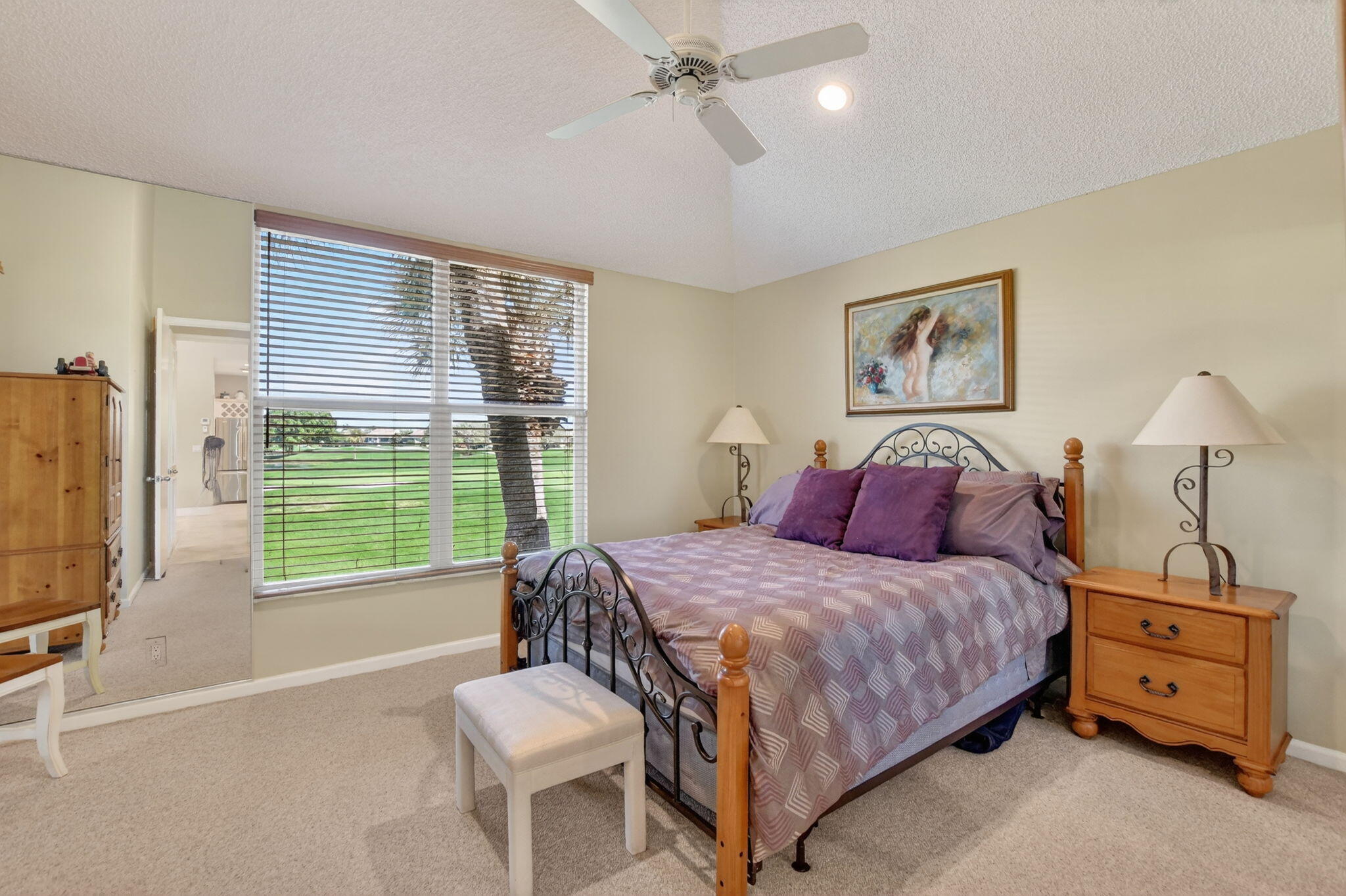 20220 Boca W Drive, Unit 702 Boca Raton, FL 33434 - Photo 19 of 51 a bedroom with a bed and a flat screen tv