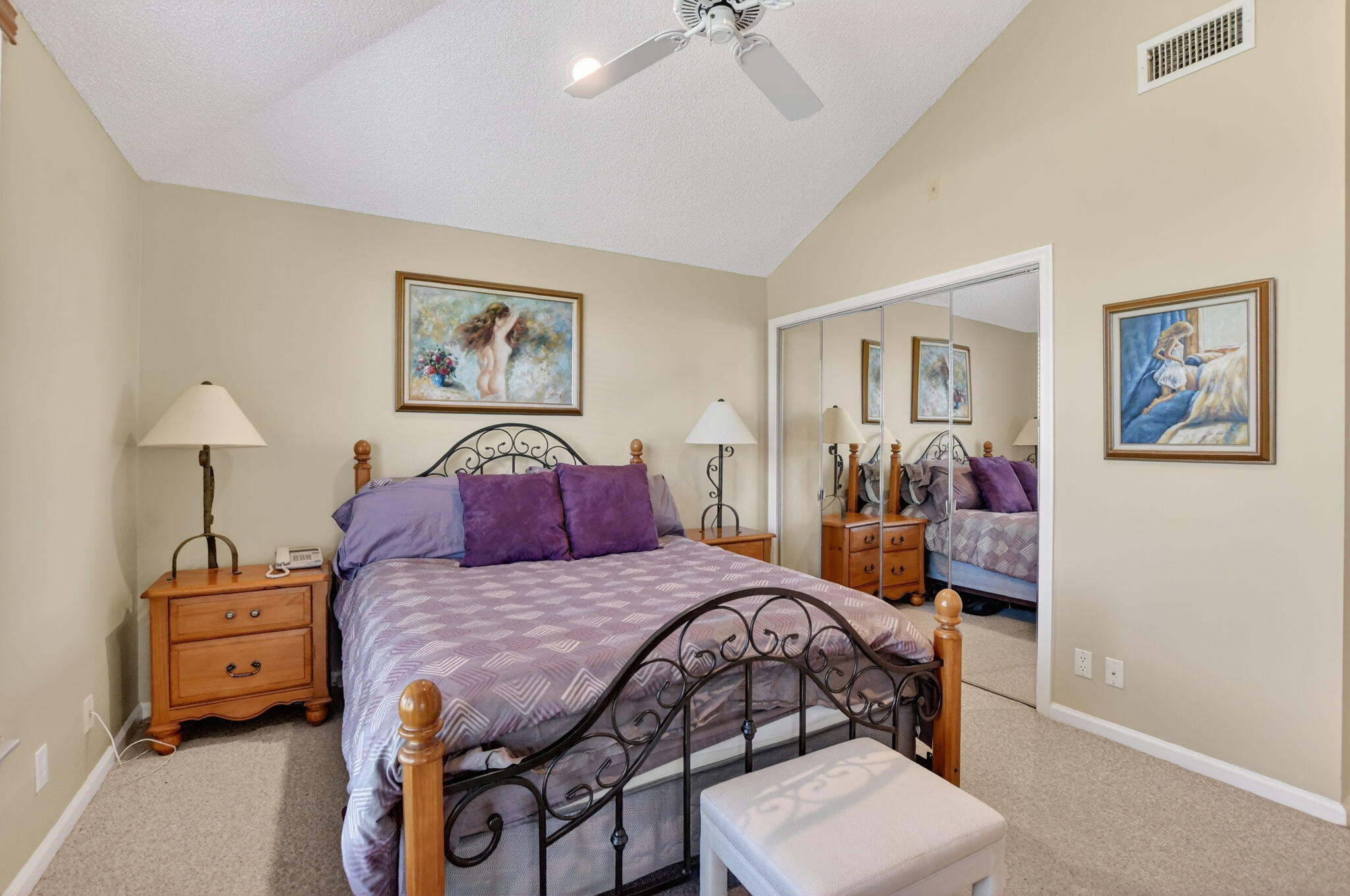 20220 Boca W Drive, Unit 702 Boca Raton, FL 33434 - Photo 20 of 51 a bedroom with a bed and a chandelier