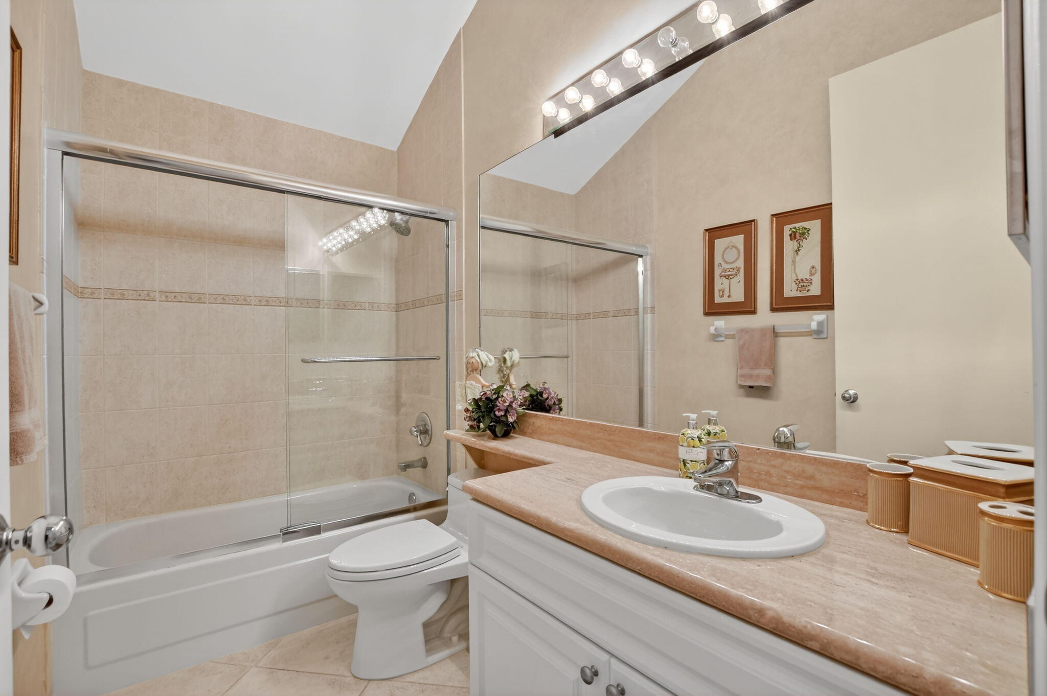 20220 Boca W Drive, Unit 702 Boca Raton, FL 33434 - Photo 22 of 51 a bathroom with a sink a toilet and shower