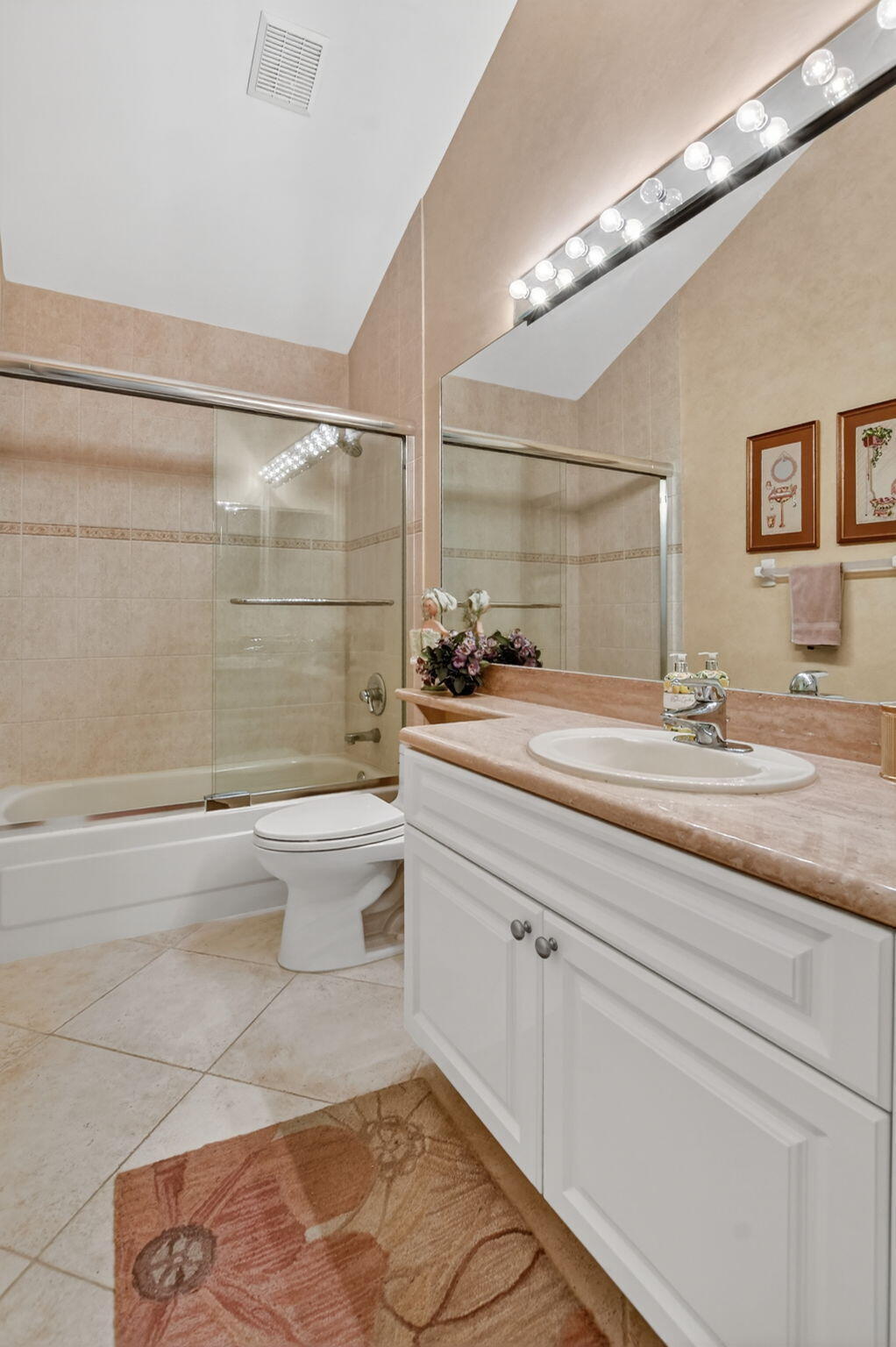 20220 Boca W Drive, Unit 702 Boca Raton, FL 33434 - Photo 23 of 51 a bathroom with a sink a toilet and shower