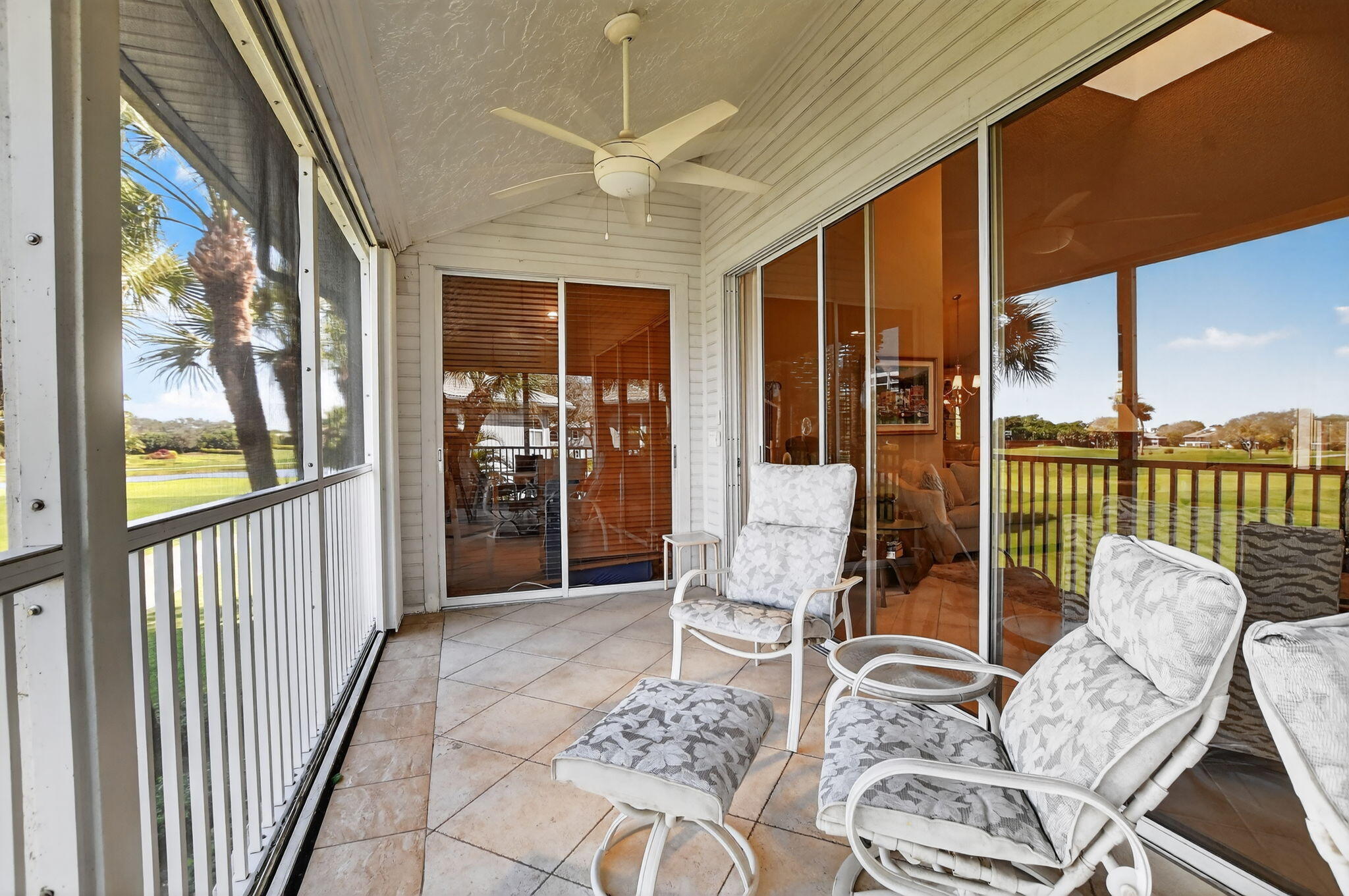 20220 Boca W Drive, Unit 702 Boca Raton, FL 33434 - Photo 27 of 51 a living room with furniture and a floor to ceiling window