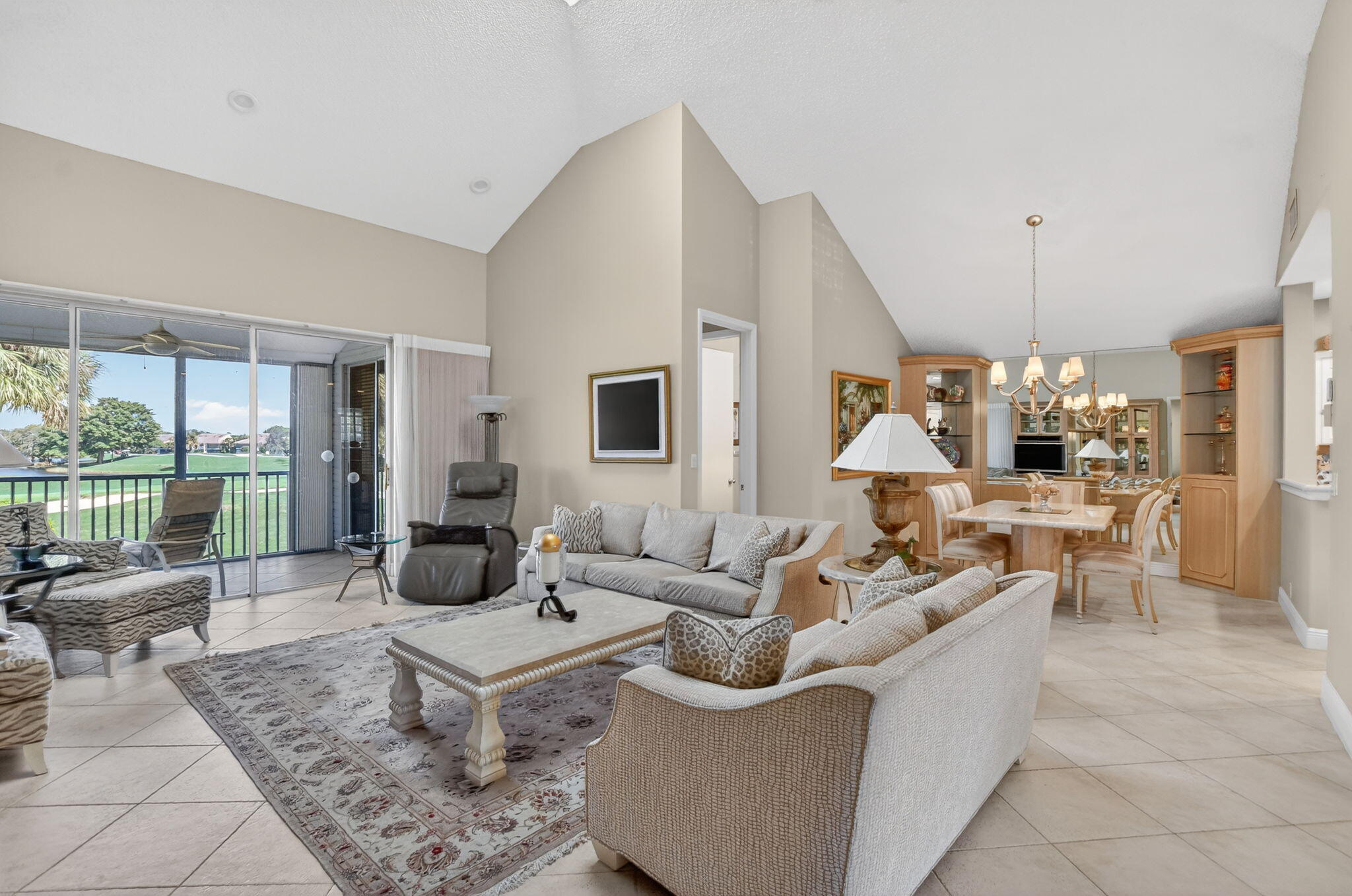 20220 Boca W Drive, Unit 702 Boca Raton, FL 33434 - Photo 3 of 51 a living room with furniture and a large window