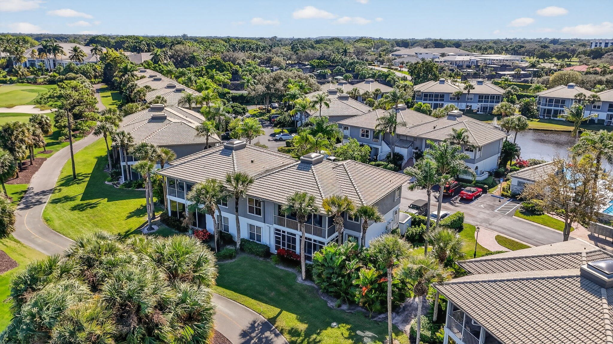 20220 Boca W Drive, Unit 702 Boca Raton, FL 33434 - Photo 38 of 51 an aerial view of a house with a garden