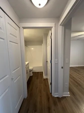 a view of a bathroom with a sink and a mirror