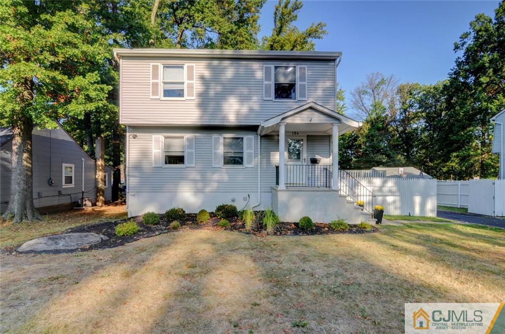 194 East Cliff Road Colonia, NJ 07067 - Photo 1 of 22 a front view of a house with a yard
