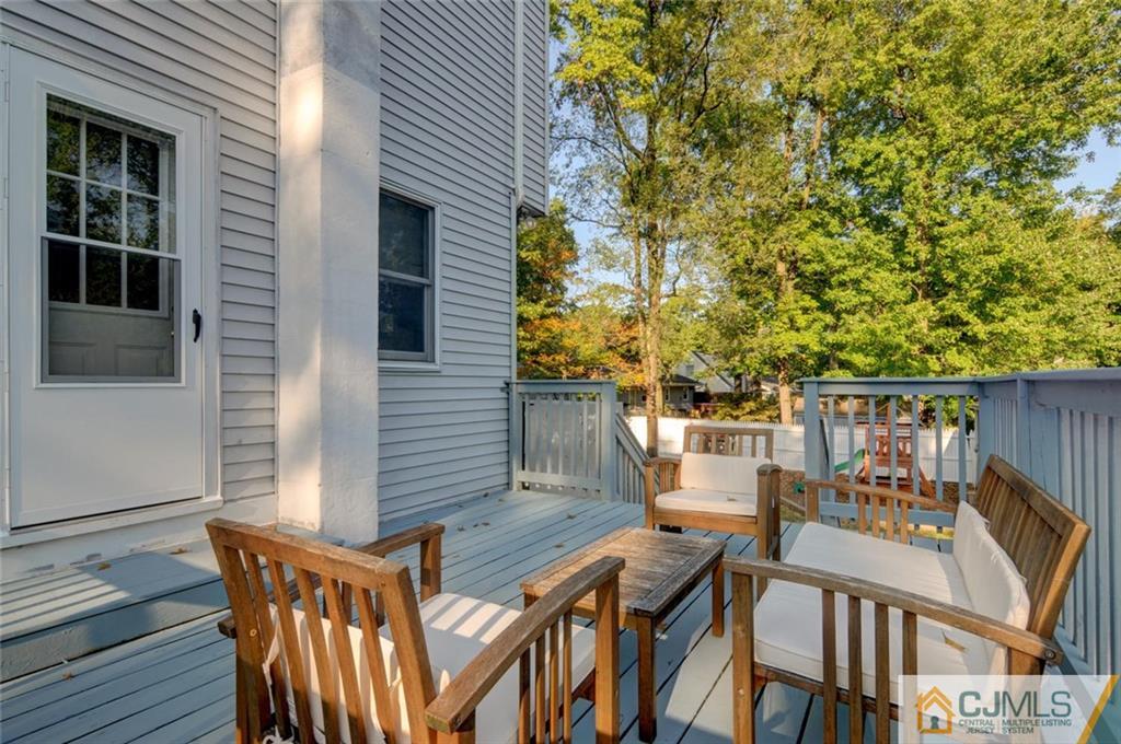 194 East Cliff Road Colonia, NJ 07067 - Photo 2 of 22 a view of balcony with furniture and trees