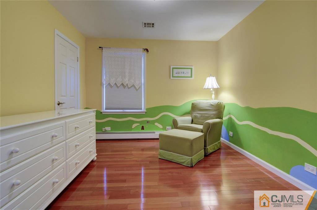 194 East Cliff Road Colonia, NJ 07067 - Photo 14 of 22 a living room with furniture and a wooden floor