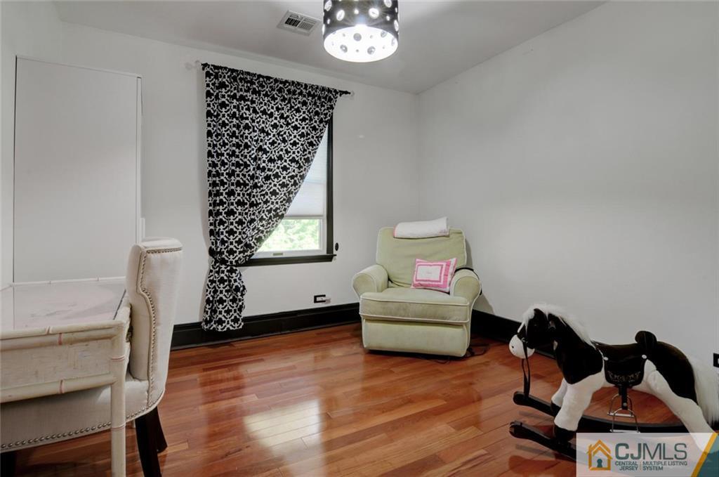194 East Cliff Road Colonia, NJ 07067 - Photo 15 of 22 a living room with furniture and a large window