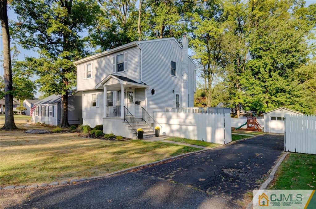 194 East Cliff Road Colonia, NJ 07067 - Photo 18 of 22 a front view of a house with a yard