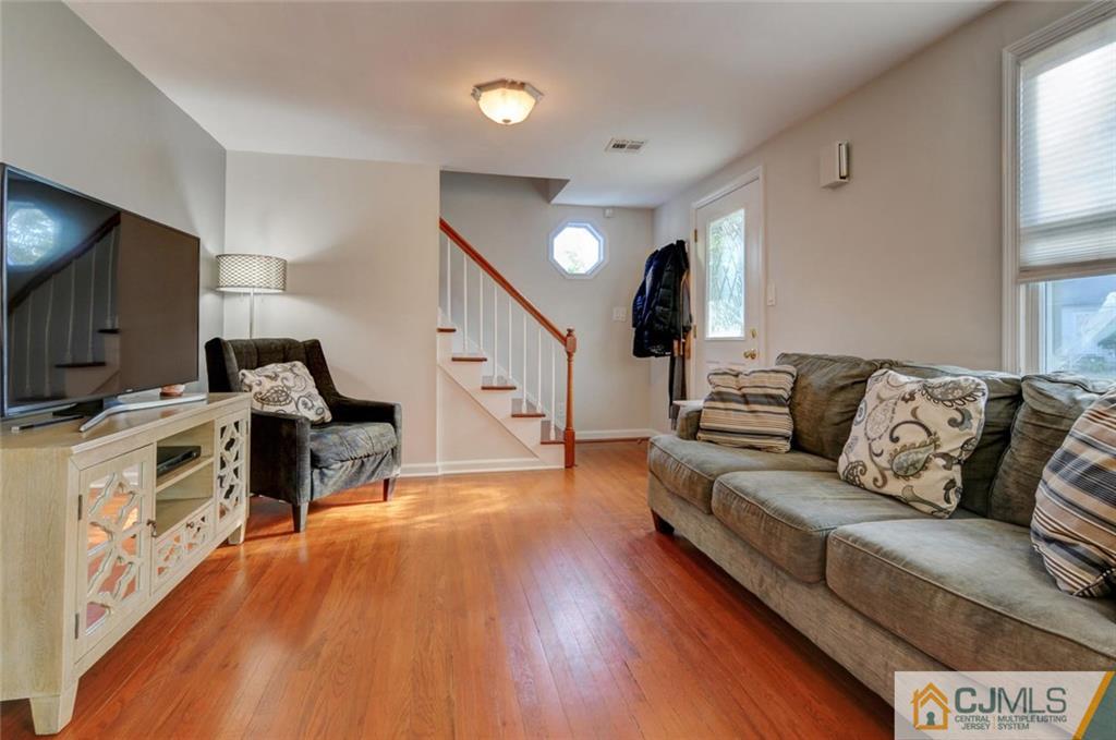 194 East Cliff Road Colonia, NJ 07067 - Photo 3 of 22 a living room with furniture and a flat screen tv