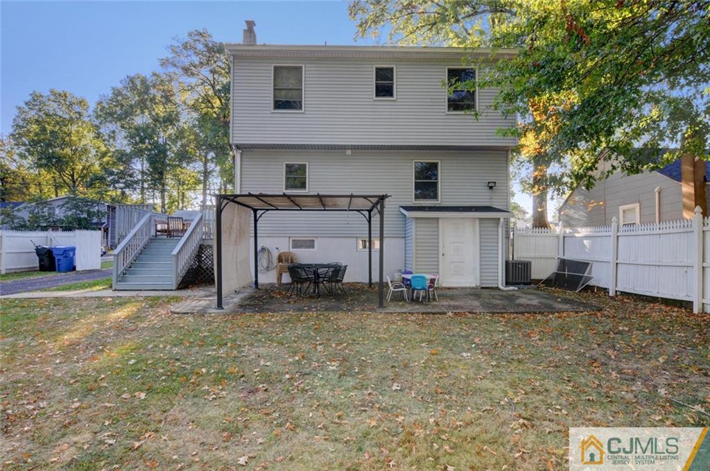 194 East Cliff Road Colonia, NJ 07067 - Photo 22 of 22 a view of a house with a yard and garage