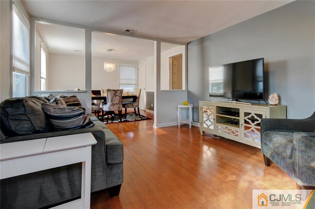 194 East Cliff Road Colonia, NJ 07067 - Photo 4 of 22 a living room with furniture and a flat screen tv