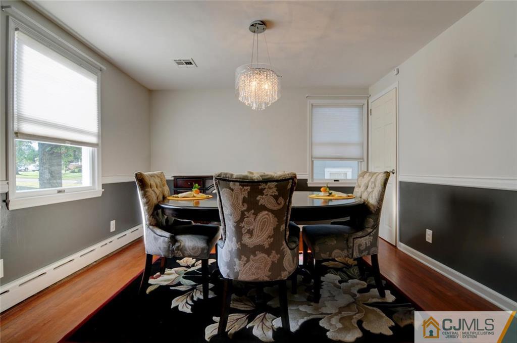 194 East Cliff Road Colonia, NJ 07067 - Photo 5 of 22 a view of a dining room with furniture window and wooden floor