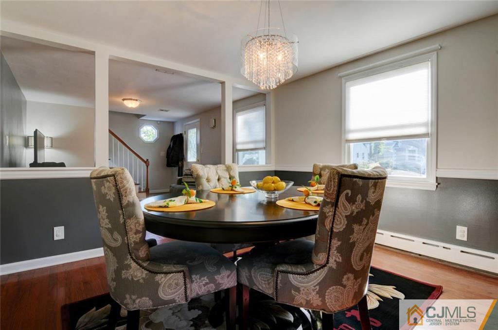 194 East Cliff Road Colonia, NJ 07067 - Photo 9 of 22 a view of a dining room with furniture and chandelier