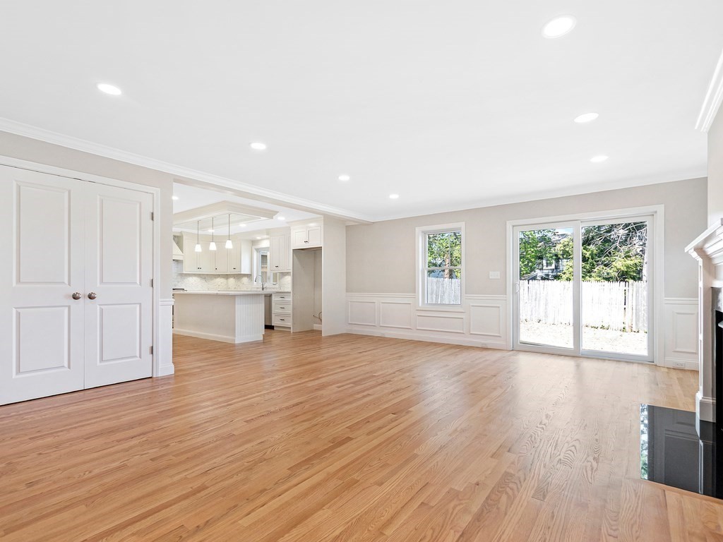 125 Thornton Road Waltham, MA 02453 - Photo 11 of 42 a view of an empty room with wooden floor and a window