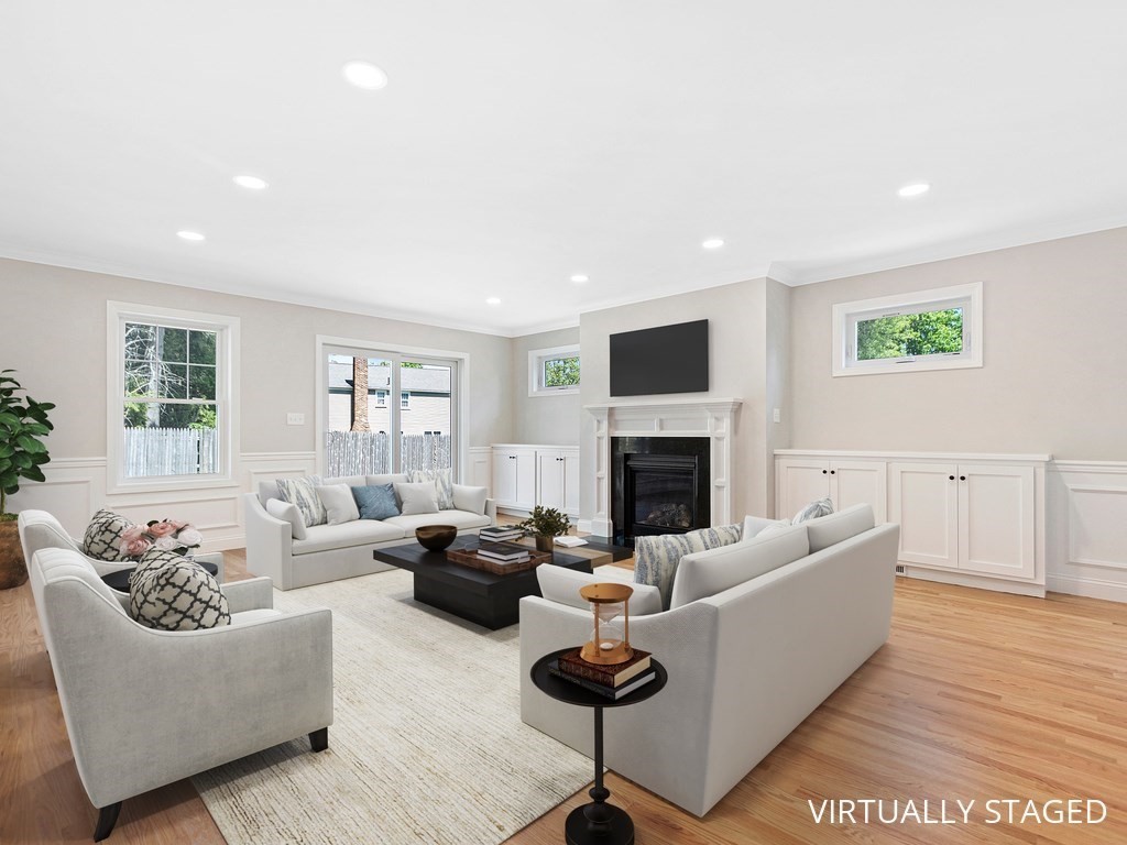 125 Thornton Road Waltham, MA 02453 - Photo 16 of 42 a living room with furniture fireplace and a window